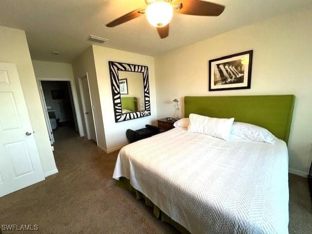 carpeted bedroom with a ceiling fan, baseboards, and visible vents