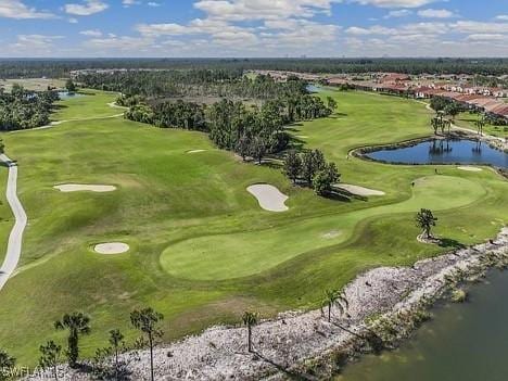 aerial view featuring golf course view and a water view