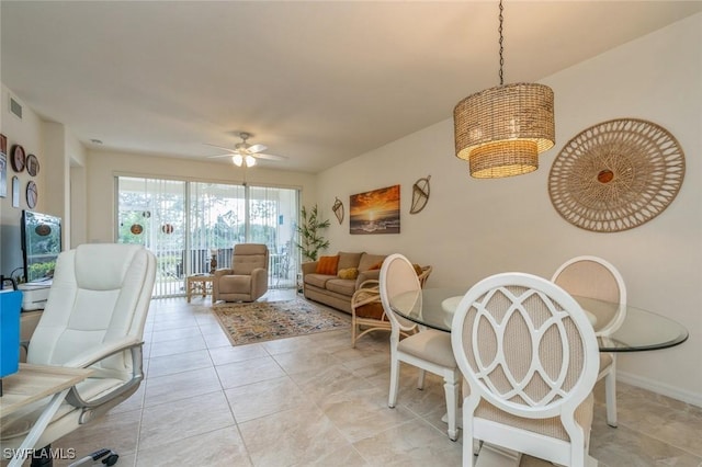 living room with ceiling fan and light tile patterned floors