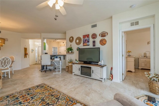 living room featuring ceiling fan