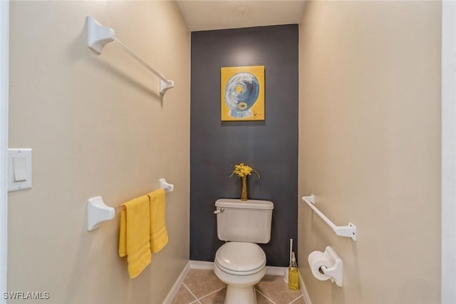 bathroom with tile patterned flooring and toilet