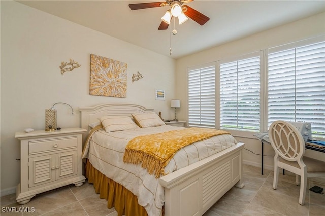 tiled bedroom with ceiling fan