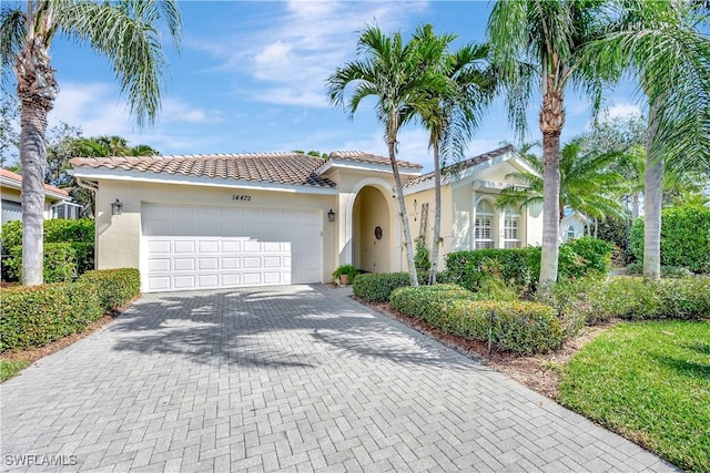 mediterranean / spanish-style house featuring a garage