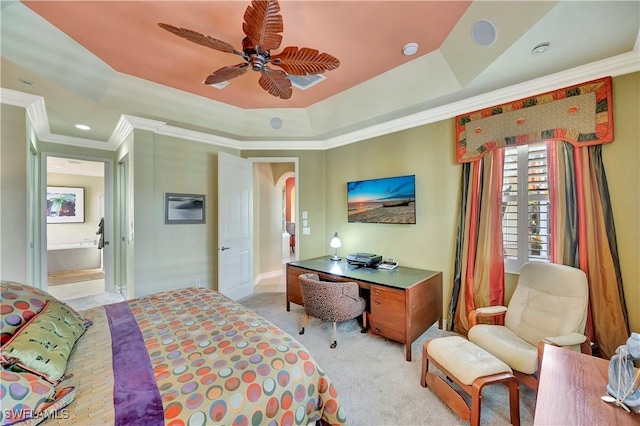 bedroom featuring light carpet, ornamental molding, a raised ceiling, and ceiling fan