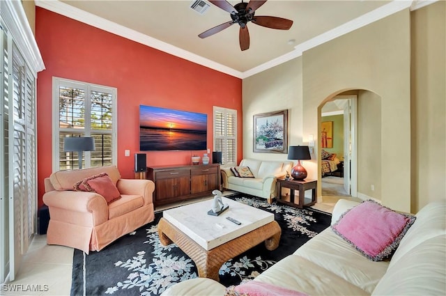 living room featuring ornamental molding, ceiling fan, and light tile patterned flooring