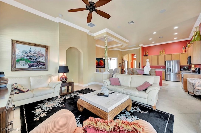 tiled living room with crown molding and ceiling fan