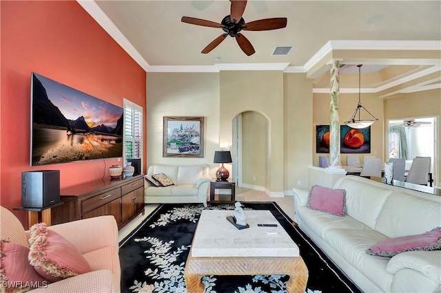 living room featuring ornamental molding and ceiling fan