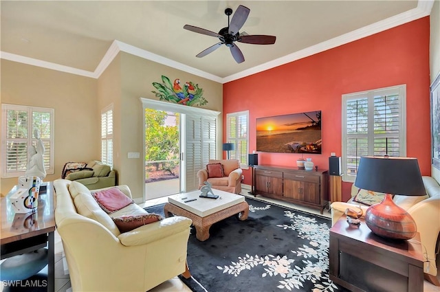 living room with ornamental molding and ceiling fan