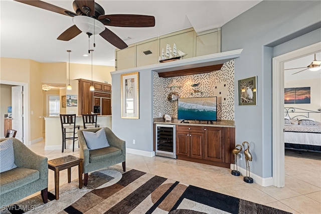 kitchen featuring wine cooler, decorative light fixtures, and light tile patterned floors