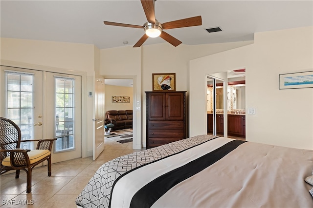 bedroom with light tile patterned floors, ceiling fan, access to exterior, vaulted ceiling, and french doors