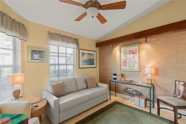 living room featuring vaulted ceiling and ceiling fan