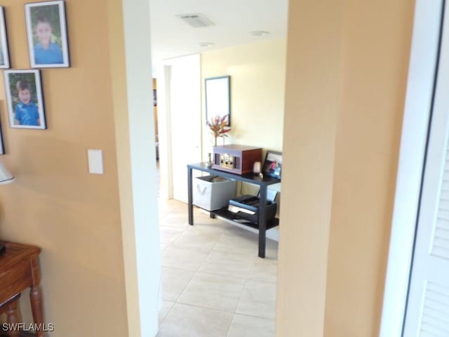 corridor with light tile patterned flooring