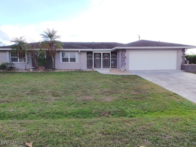 single story home featuring a garage and a front lawn