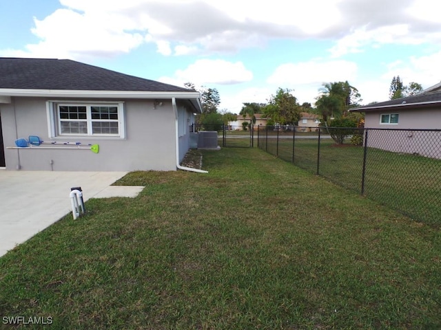 view of yard featuring central air condition unit