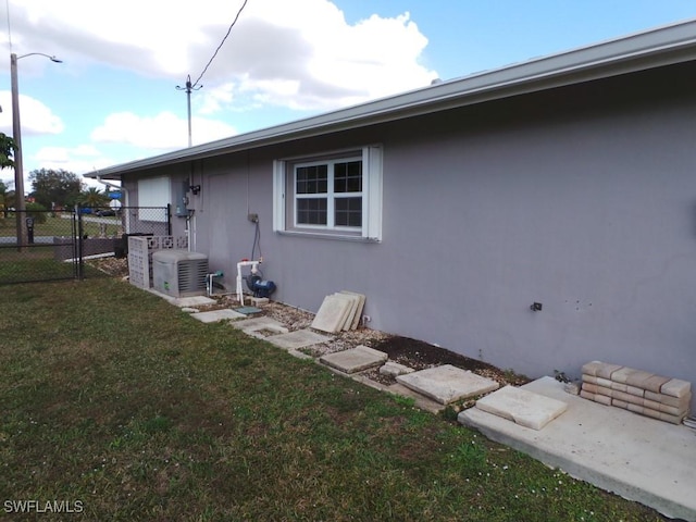 view of property exterior with a lawn