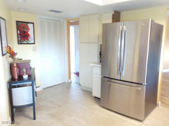 kitchen featuring stainless steel refrigerator