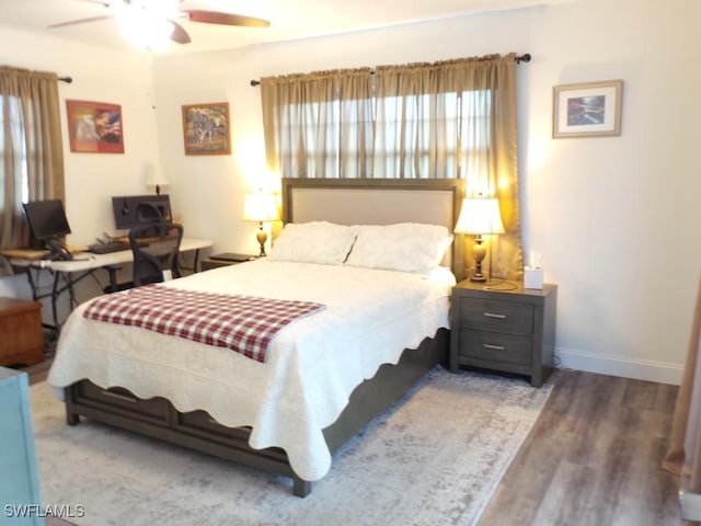 bedroom featuring ceiling fan and dark hardwood / wood-style floors