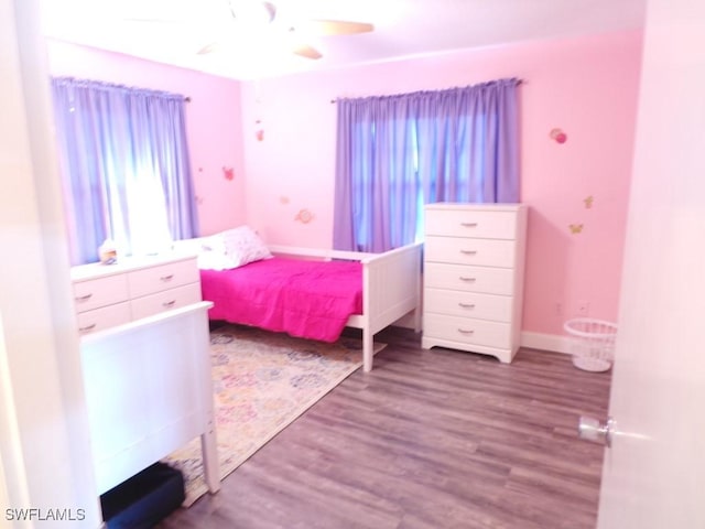 bedroom featuring hardwood / wood-style floors and ceiling fan