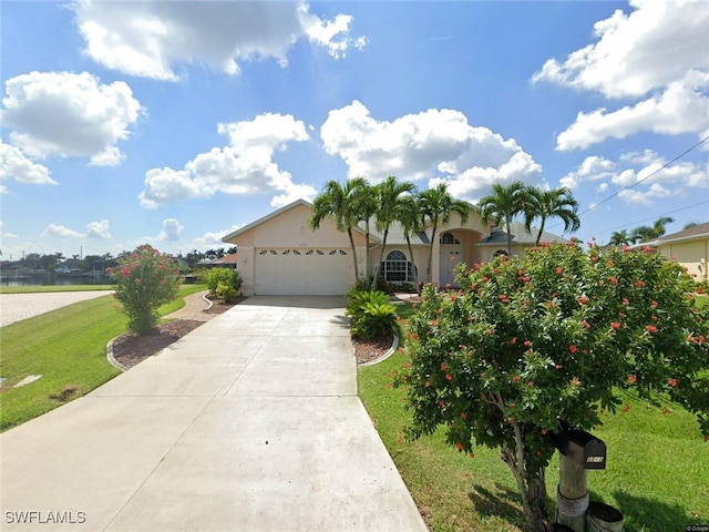 view of front facade featuring a garage and a front yard