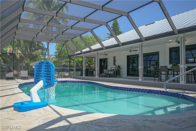 view of swimming pool with a lanai, a patio, and ceiling fan