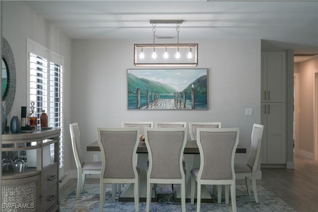 dining room with hardwood / wood-style flooring