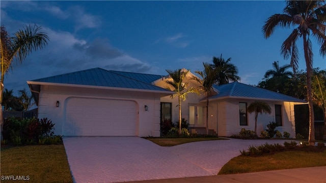 ranch-style house featuring a garage