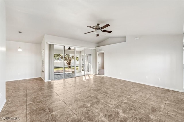 empty room with vaulted ceiling, a ceiling fan, and baseboards