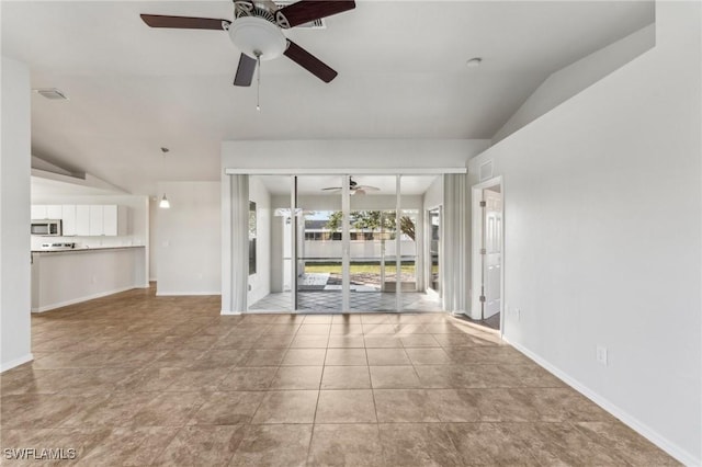 unfurnished living room with lofted ceiling, light tile patterned floors, visible vents, and baseboards