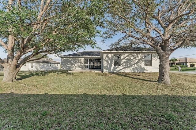 ranch-style home with a front yard