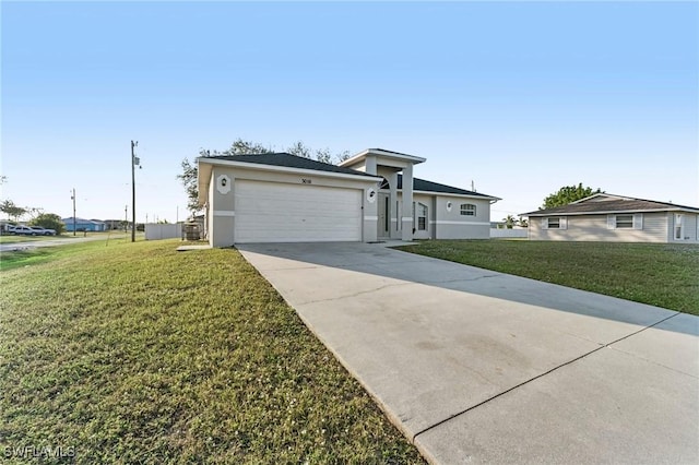 view of front of property featuring a garage, driveway, a front lawn, and stucco siding