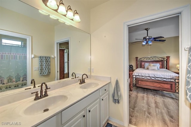 bathroom with vanity, hardwood / wood-style floors, and ceiling fan