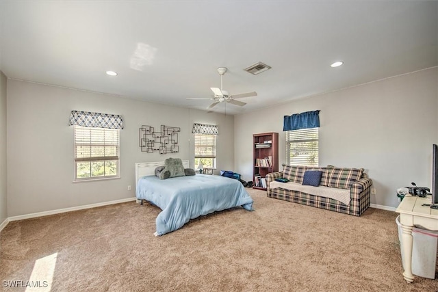 bedroom with ceiling fan and carpet flooring