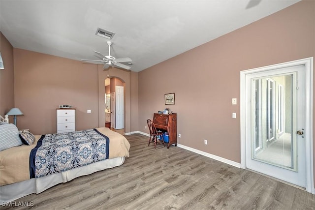 bedroom featuring ceiling fan, vaulted ceiling, access to outside, and light hardwood / wood-style floors