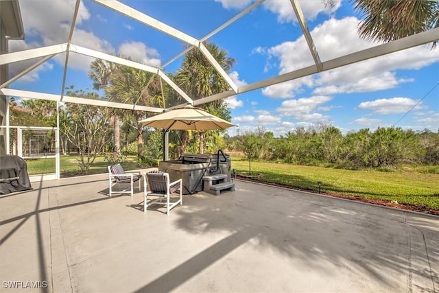 view of patio with a hot tub and a lanai