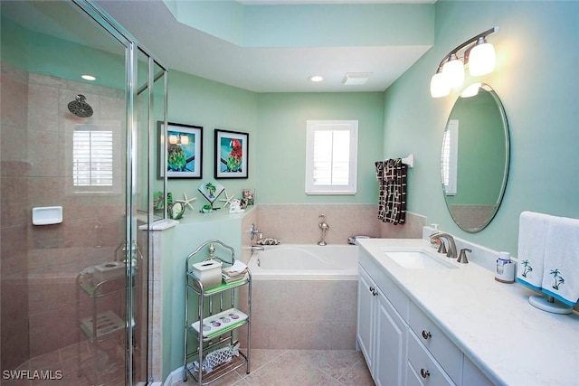 bathroom featuring tile patterned flooring, vanity, and separate shower and tub