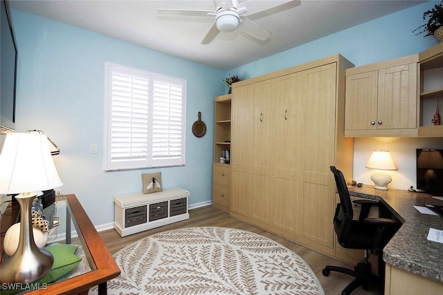 office area with ceiling fan and light wood-type flooring