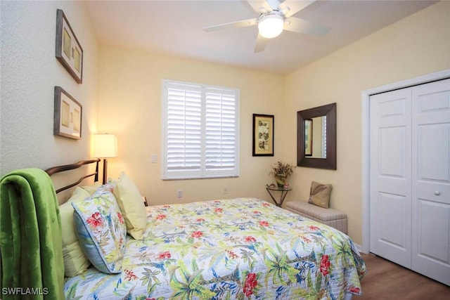 bedroom featuring hardwood / wood-style flooring, a closet, and ceiling fan