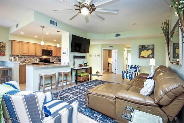 living room with ceiling fan