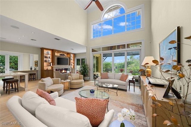 living room with a healthy amount of sunlight and light hardwood / wood-style floors