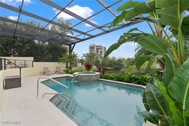 view of swimming pool with an in ground hot tub, a lanai, and a patio area