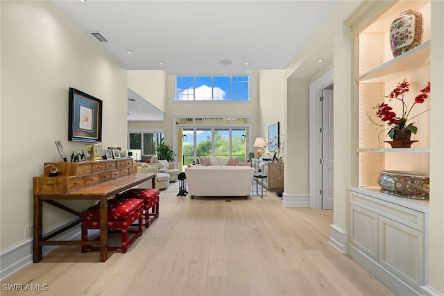 hall with light hardwood / wood-style floors