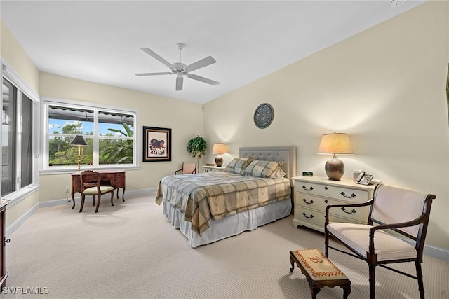 carpeted bedroom with lofted ceiling and ceiling fan