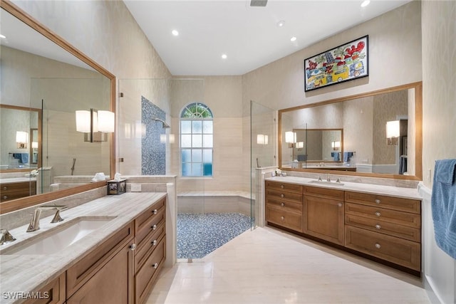 bathroom featuring walk in shower, tile patterned floors, and vanity