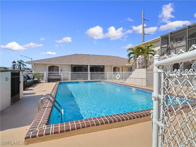 view of pool featuring a patio area