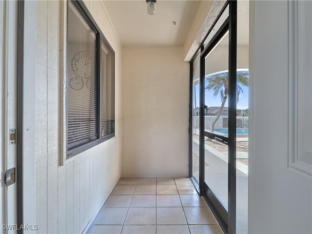 hallway with light tile patterned floors