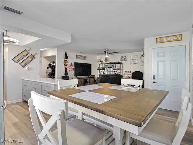 dining area featuring light hardwood / wood-style flooring and ceiling fan