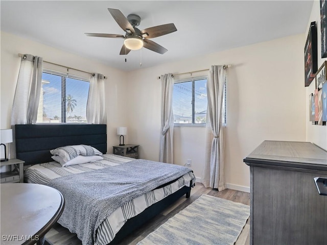 bedroom featuring light hardwood / wood-style floors and ceiling fan