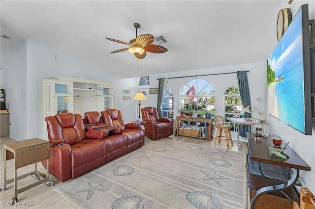 living room with ceiling fan and hardwood / wood-style floors