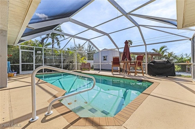 view of pool featuring grilling area, a lanai, and a patio