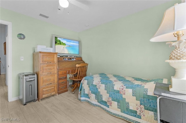 bedroom with light hardwood / wood-style floors and ceiling fan